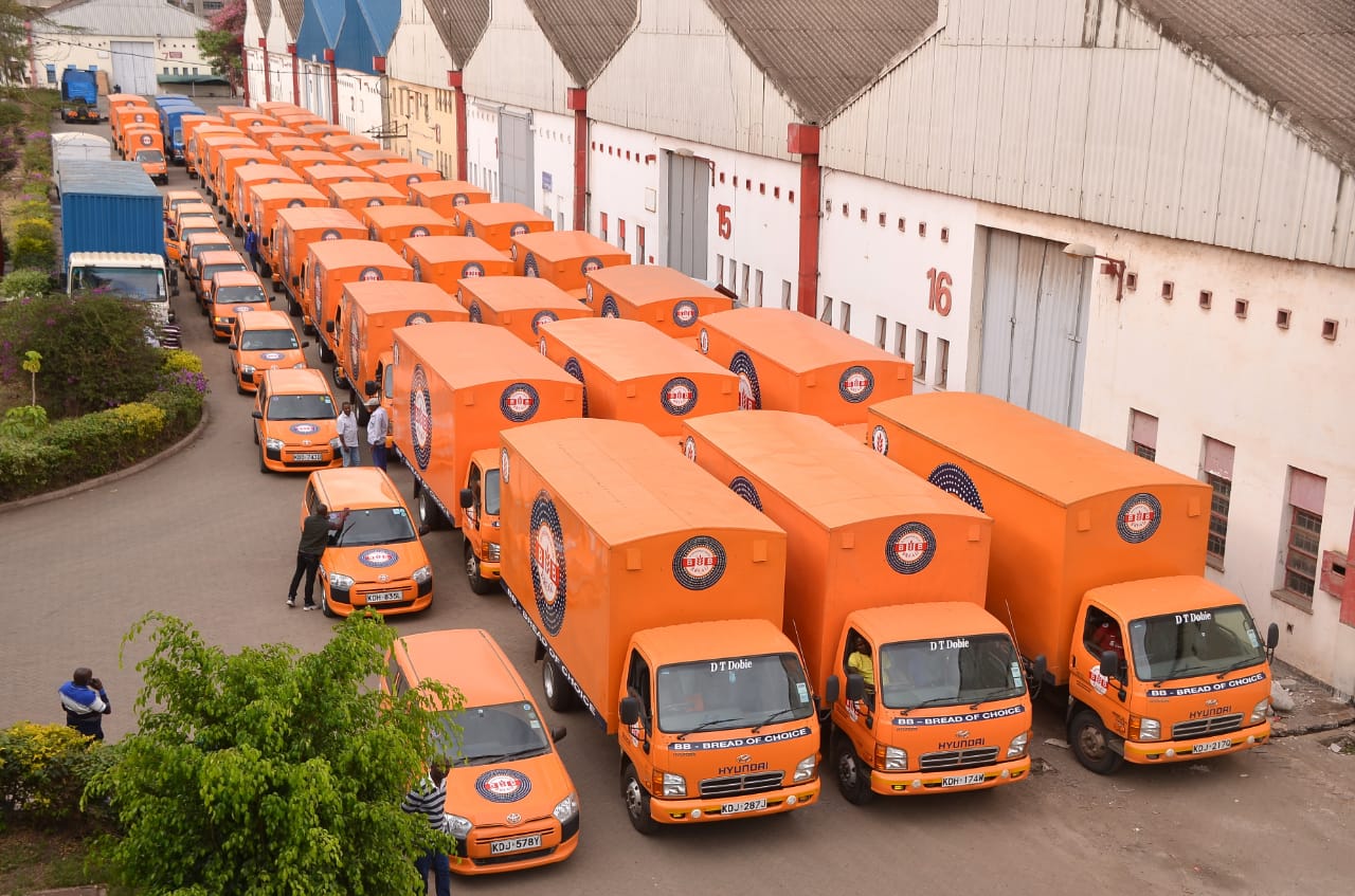 Company building and delivery trucks.